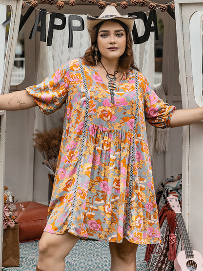 Plus Size Ruched Printed Half Sleeve Mini Dress-Angel Casuals